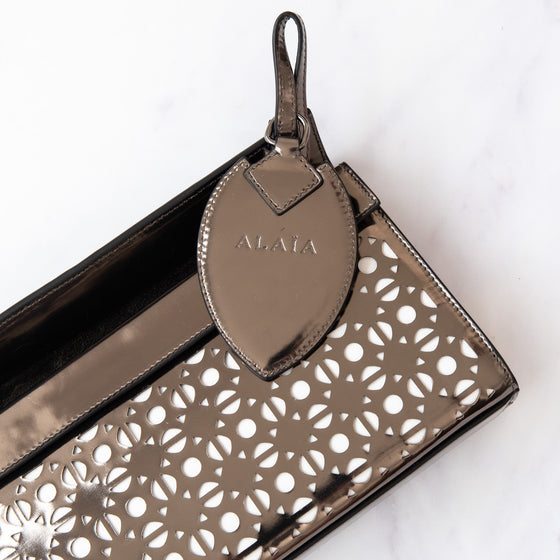 Alaia Metallic Laser Cut Patent Leather Clutch