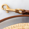 Saint Laurent Cassandre Round Raffia And Leather Crossbody Bag